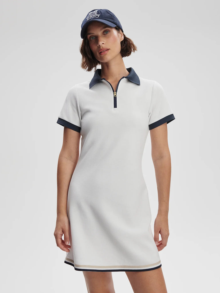 We love a tennis dress and the Valentina does not disappoint.&nbsp; It comes in a preppy A line shape with a contrast navy detail around the collar, sleeves and hem along with a short zip up front.&nbsp; Crafted in a pique double knit fabric and housing a pair of fitted shorts underneath for modesty, you won't be able to wait to get on the court.&nbsp;&nbsp;