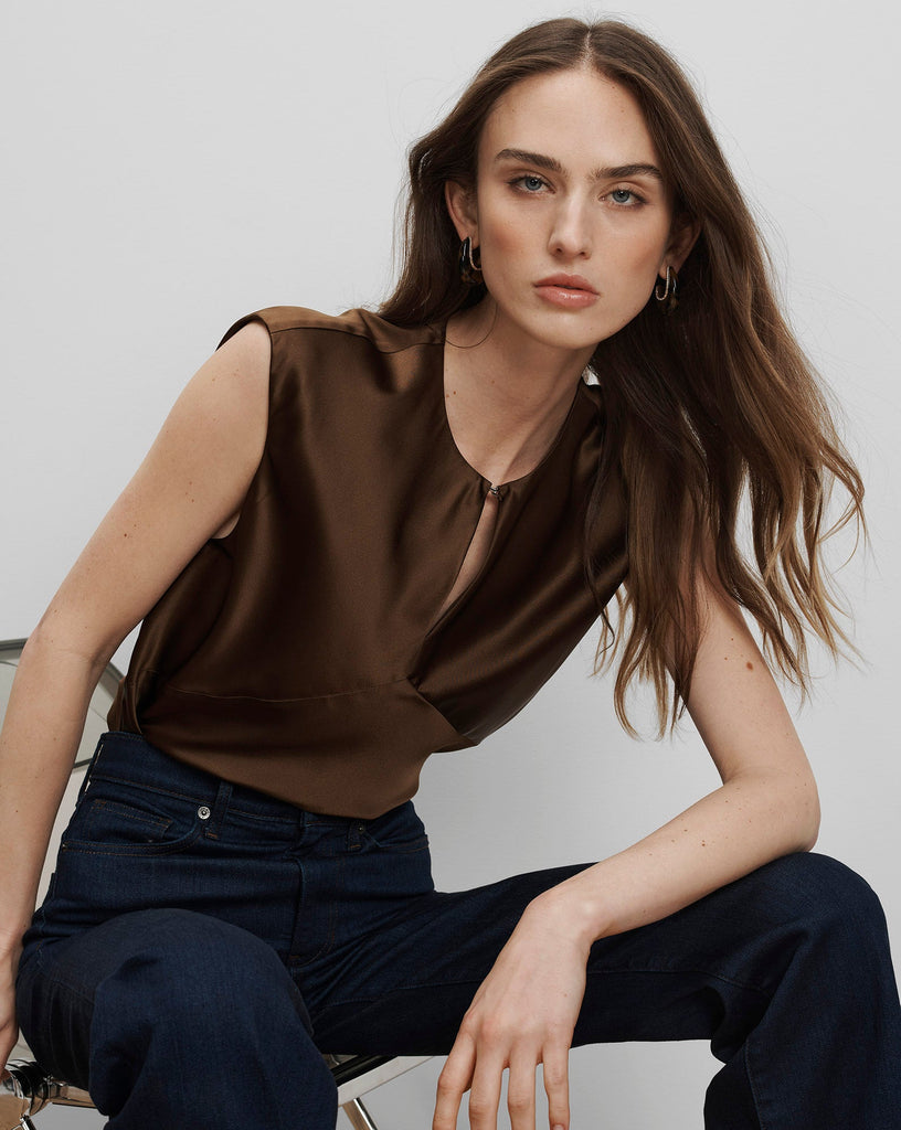 Simple is sometimes best and this feminine silk blouse from Veronica Beard is classic , elegant dressing at it's best.&nbsp; Featuring a slinky drape, cap sleeves, angled seams for a super flattering fit and a front keyhole closure this is perfect paired with the Clover Skirt but works equally well with denim.&nbsp; &nbsp;A wardrobe piece you will reach for again and again.