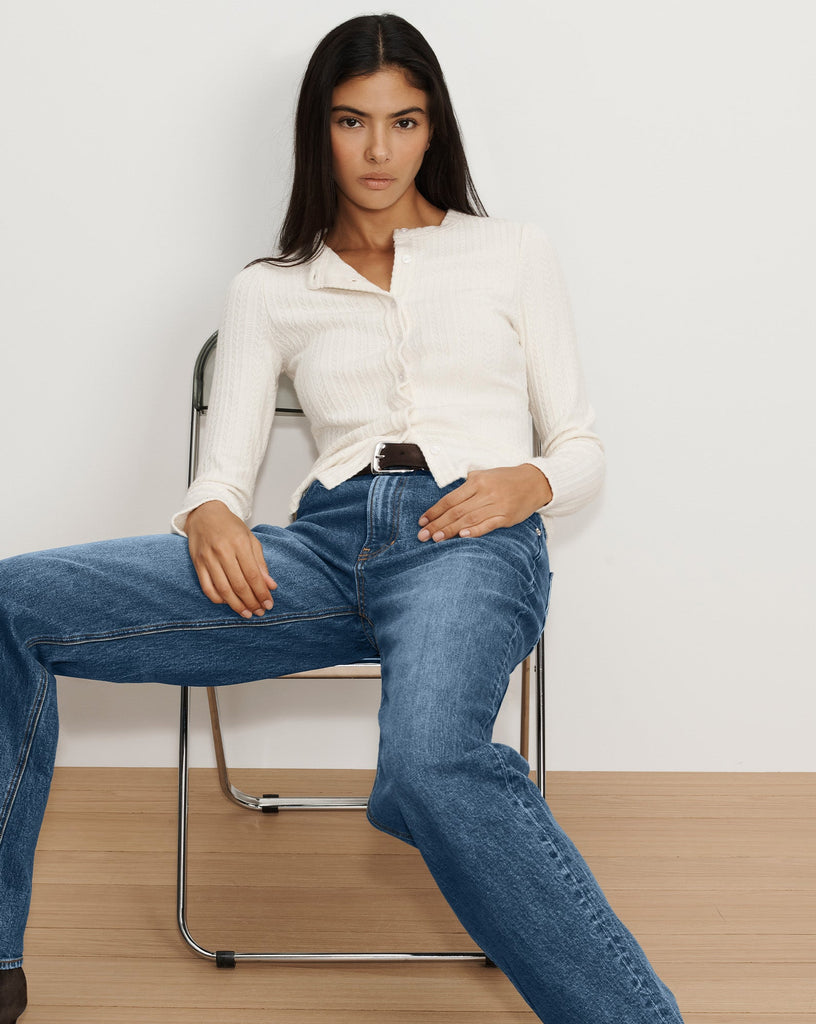 This will quickly become your go to cardigan.&nbsp; Crafted from a premium stretch knit in an off white Lira features a slim fit, an overall decorative pointelle knit pattern, long sleeves and a classic crew neckline.&nbsp; Gorgeous on it's own, an excellent layering piece under jackets, perfect with your wide legged denim or trousers the options are endless.&nbsp;&nbsp;