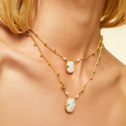 A classic design from Gas Bijoux this beautiful necklace is handcrafted from gold plate and features a gold plaited chain and pretty mother of pearl medallions.&nbsp; This clever piece can be worn as a double necklace or one long necklace - so 2 for 1!