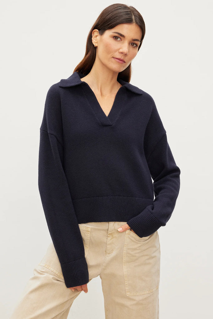 The Lucie Jumper is a super soft cotton cashmere knit from Velvet by Graham & Spencer. In an easy to wear navy, this pullover features a preppy/sporty collar and long sleeves. This is perfect paired with your favourite skirt or denim!