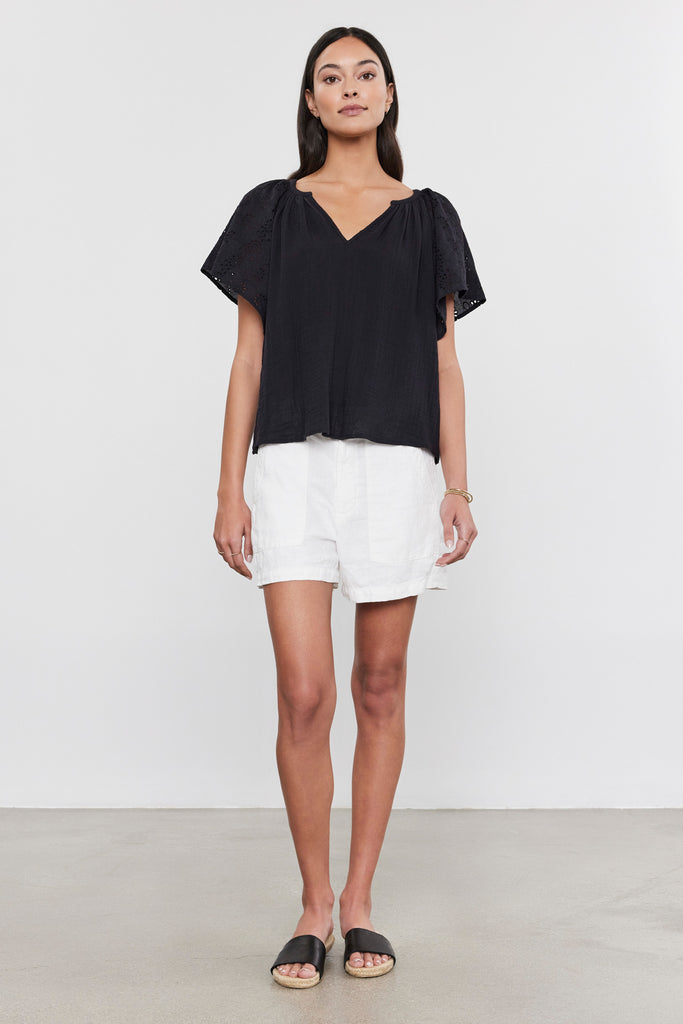 The Tish top from Velvet by Graham &amp; Spencer is crafted from their signature super soft cotton gauze and features embroidered eyelet flutter sleeves and a flattering v neck.&nbsp; Charming and effortless this is perfect paired with your favourite shorts for when the temperatures heat up!&nbsp;&nbsp;