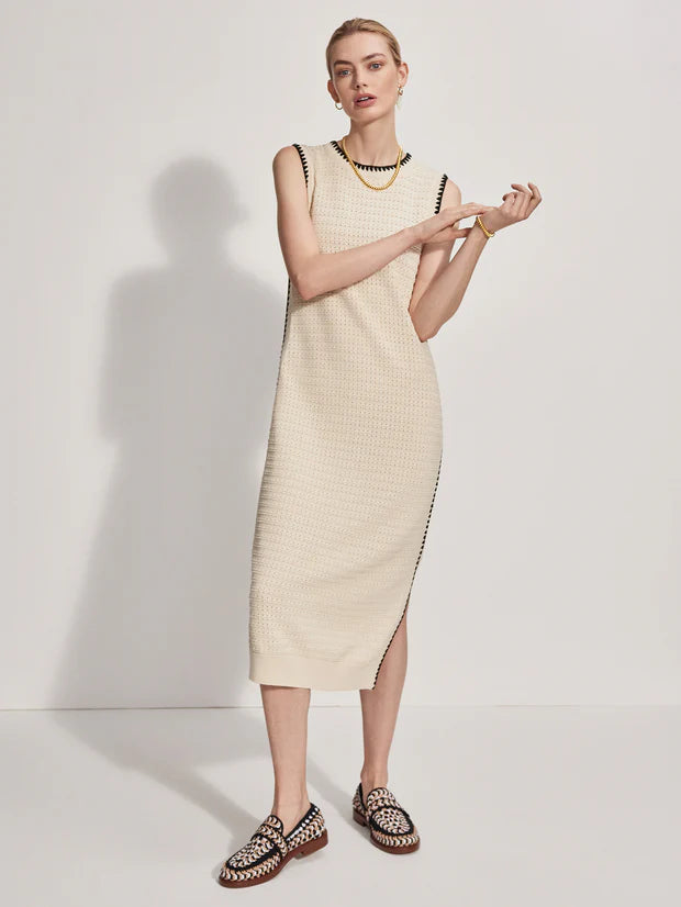 Be on trend with this chic knit dress from Varley. Crafted from 100% cotton, it features a round neckline and side splits, with a black crocheted trim on the neckline, sleeves and down the sides. Pairs equally well with trainers, sandals and loafers.
