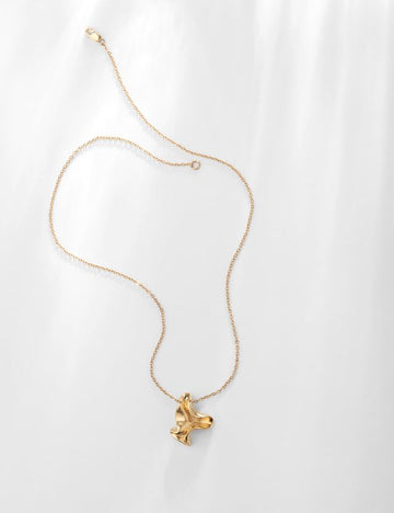 The Iris Pendant Necklace from Louise Damas is so pretty!  Featuring a little iris on a thin and simple chain and nestling in the hollow of the neck this will dress up the simplest of dresses or tops.  Crafted from brass gilded with 24k fine gold and made by hand in Louise Damas' workshop in Paris. 