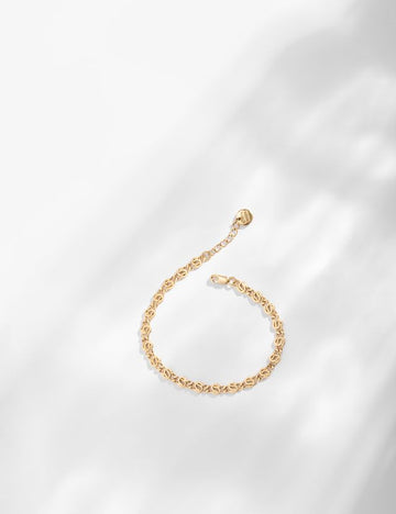 This is the perfect bracelet for layering or wearing on it's own.  A sophisticated piece which represents a chain of small iris buds.  Handcrafted in Louise Damas' Paris workshop this pretty bracelet is gilded in recycled 24k fine gold RJC certified onto brass.  