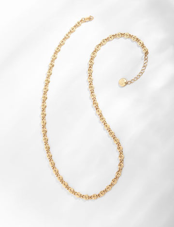 The Iris Chain Necklace from Louise Damas is an intricately woven chain which is meant to represent buds forming in the Spring.  Handcrafted from brass and gilded with 24k fine gold in Louise Damas' workshop in Paris this chain measures 39cm long and features an adjustable 3cm bit.   