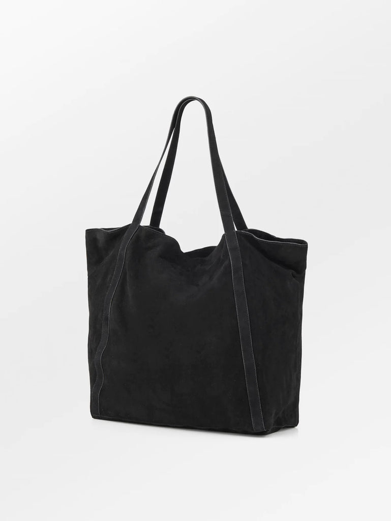 The Becksondergaard suede Eden bag is the perfect everyday bag with an internal zip up pocket and a clip closure.  It measures 38 x 40cms so will carry everything from laptops and books to childrens snacks and toys.  This gorgeous black bag is a true classic and will compliment any outfit.  