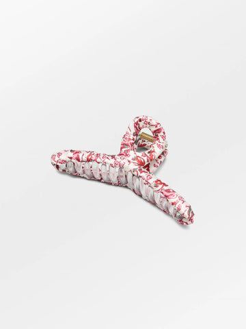 This elegant fabric wrapped hair claw in a pretty print will complement any outfit while keeping those tresses at bay. Also available in Green.