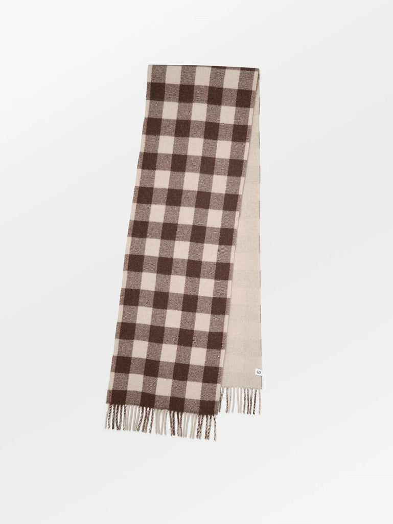 The Florenca scarf by Becksonderguaard will be a perfect addition to your autumn/winter wardrobe   It is made from 100% recycled wool, with checks on one side and plain on the other.  It measures 37 x 220 cm.   Also available in Cypress Green. 