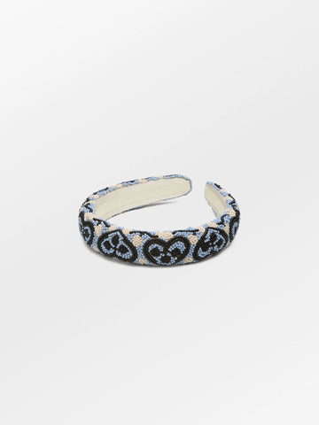 This gorgeous hairbrace from Becksondergaard is handcrafted and adorned with glass beads in a heart design.  It will add that extra touch to any outfit.