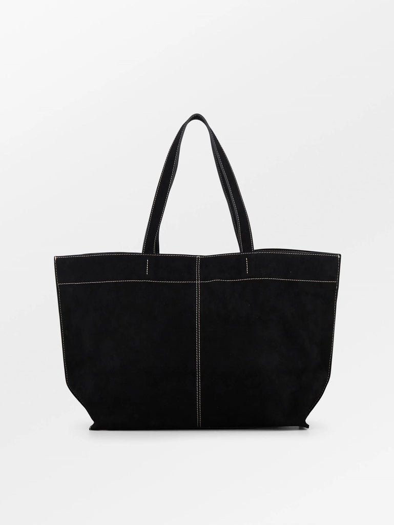 The Suede Aubrey Bag from Becksöndergaard is a stylish bag crafted from 100% cow suede and features contrasting stitching. It can be worn over the shoulder or carried by hand and has one large compartment with a hook closure and a separate, zippered pocket. It measures 40 x 34 cm and is big enough to carry a laptop.

