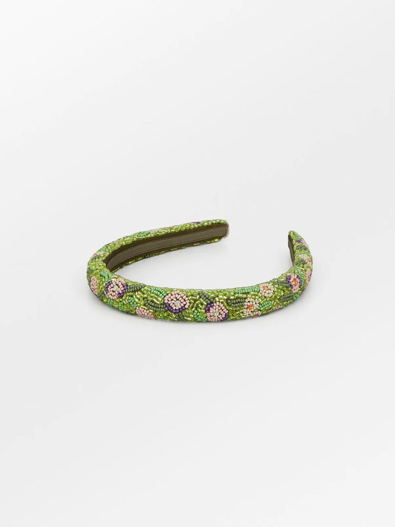 Beautiful glass beads adorn this stunning floral headband which will add that extra touch to your outfit.  