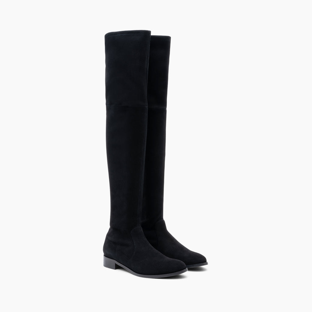 The Gloria Thigh-High Boots from Parallele are made from a stretch suede in an always classic black, they also have a leather sole with an anti-slip pad. The laminated leather heel measures 2.5cm making these the perfect boots to walk around town in all day everyday! The stem of the boot measures 60cm.