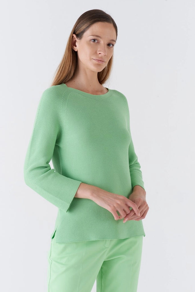 The Monello Jumper from Amina Rubinacci is crafted from 100% cotton. In a vibrant green this fine cotton knit is a perfect transitional piece and looks fab paired with white jeans. Featuring a wide crew neckline, wrist length sleeves and subtle slits at the sides, this jumper is easy to wear all day everyday.