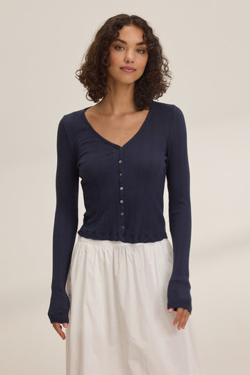 The Drew Cardigan is a super soft cotton tee shirt like cardigan from Velvet by Graham &amp; Spencer.&nbsp; In easy to wear navy this lightweight cardigan features a flattering v neck and looks fab with nothing underneath it or paired with your favourite wide legged white denim.