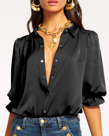 We are delighted to be stocking uber cool American brand Ramy Brook this season and we think you'll thank us!&nbsp; Created for seamless tucking the Dina Bodysuit will immediately elevate your favourite jeans and a top look!&nbsp; Crafted from super soft satiny fabric and featuring a high collar, central buttoning and puffed sleeves this is classic yet modern.&nbsp; Perfect for date night or a night out with the girls!