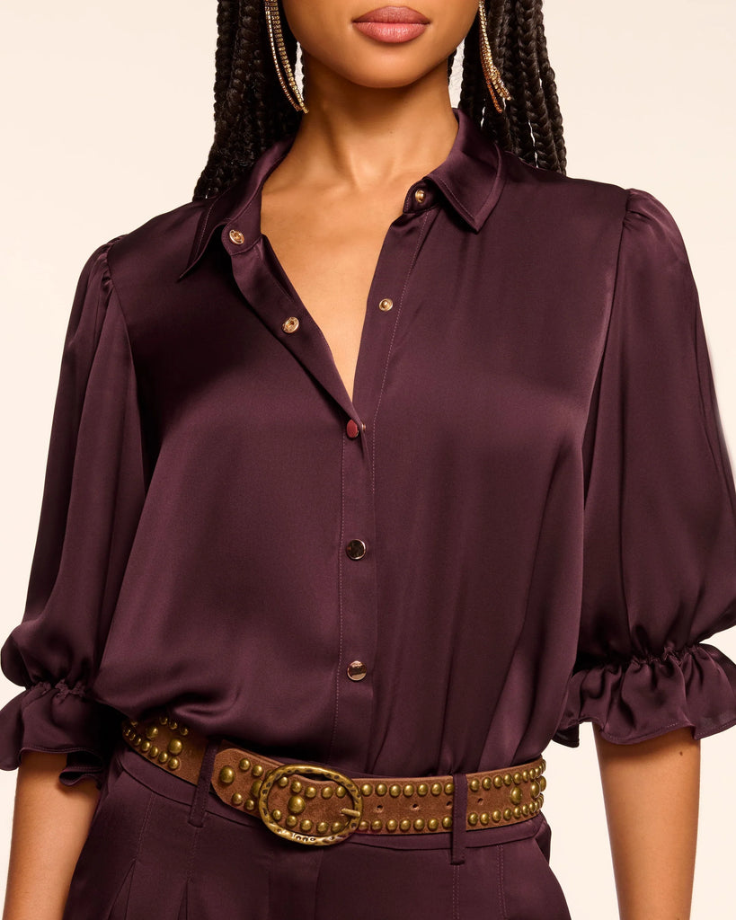 We are delighted to be stocking uber cool American brand Ramy Brook this season and we think you'll thank us!&nbsp; Created for seamless tucking the Dina Bodysuit will immediately elevate your favourite jeans and a top look!&nbsp; Crafted from super soft satiny fabric and featuring a high collar, central buttoning and puffed sleeves this is classic yet modern.&nbsp; Perfect for date night or a night out with the girls!