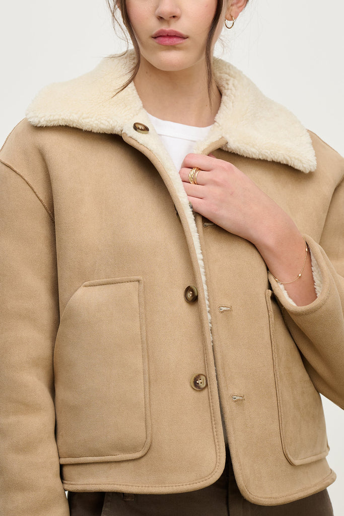 We love Velvet by Graham &amp; Spencer's jackets and the Amara does not disappoint.&nbsp; Super versatile this style is reversible and features cozy faux sherpa on one side and smooth faux suede on the other.&nbsp; With front pouch pockets on both sides and a centre buttoning this effortlessly combines function with style.&nbsp; Looks fab paired with your Autumn denim.