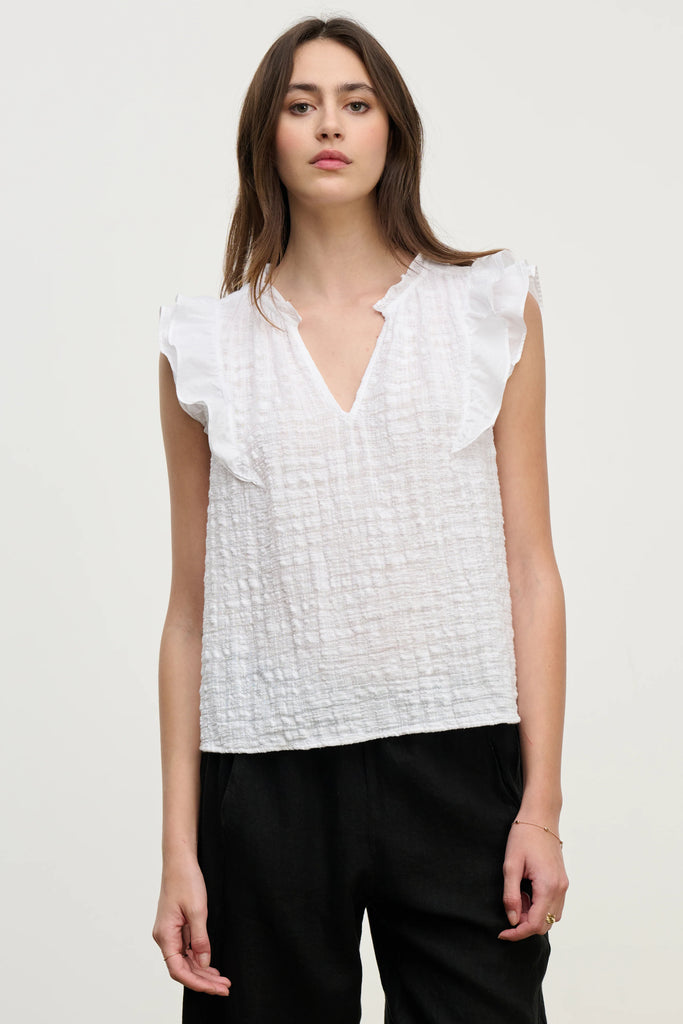 The Eva Blouse is a Summer top you will reach for again and again.&nbsp; Crafted from super soft textured cotton gauze and featuring a relaxed fit with a soft cotton contrast ruffle sleeve and a flattering v neck this is perfect paired with your favourite denim cut offs for a cool girl Summer vibe.