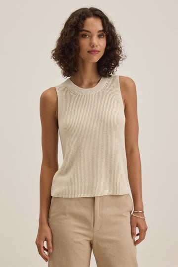 The Muna Knit Vest from Velvet by Graham &amp; Spencer is crafted from their signature super soft cotton and definitely merits a place in your knit collection!&nbsp; In always wearable ivory and cut slightly in at the shoulders this looks great paired with your favourite denim jeans or skirts.