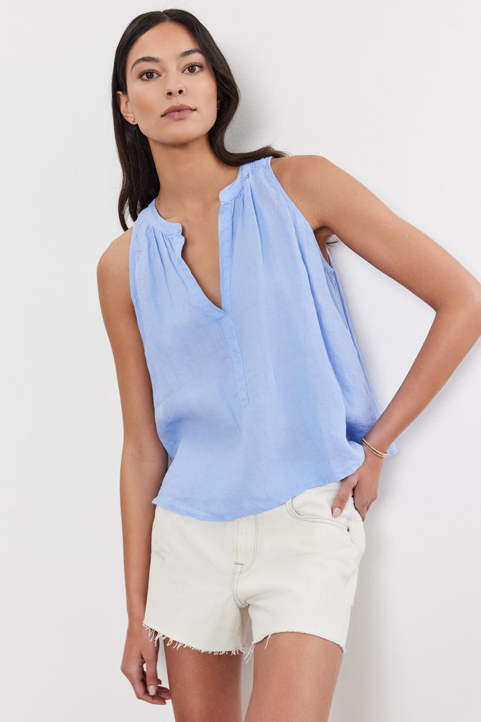 The Tacy top from Velvet by Graham &amp; Spencer is crafted from super soft breezy woven linen which is the perfect weight for warmer weather!&nbsp; Featuring a flattering v neck, a high low scooped hemline and shirred details on the rear this pretty top pairs perfectly with your favourite shorts for a laid back Summer vibe.