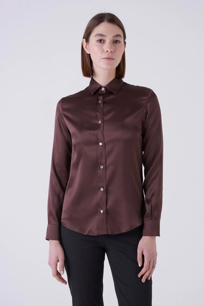 In the colour of the season, chocolate brown, and crafted from a super soft stretch silk the Yuppy Shirt is a classic piece that pairs beautifully with chocolate brown trousers or your favourite denim.&nbsp; From uber luxe Italian brand Amina Rubinacci this is a a top you will reach for again and again.