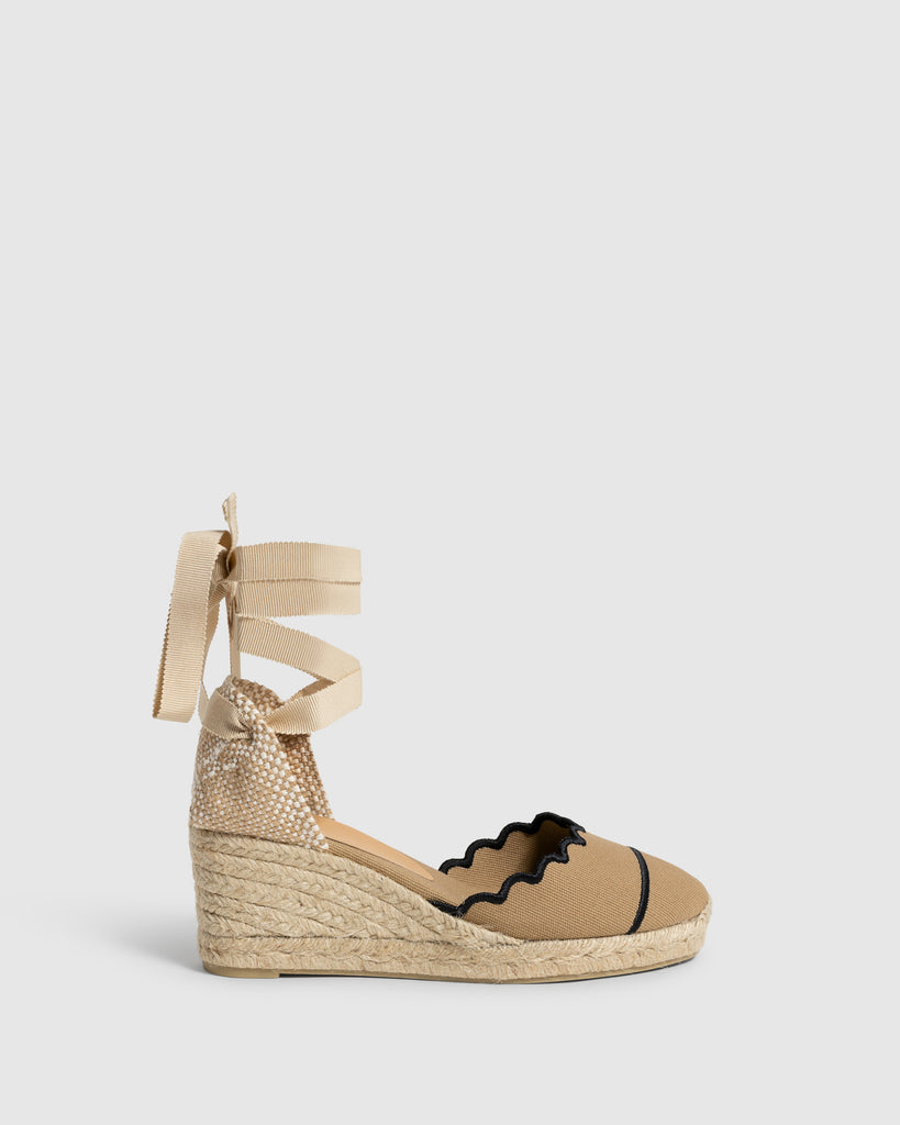 Who knew when Castaner first designed wedge espadrilles for Yves Saint Laurent in the 1960's they would become the Summer wardrobe essential they now are.  The Cini 6 wedge is crafted from organic cotton canvas and woven jute at the heel and features a closed and rounded toe and soft canvas tie fastenings. Wear these literally with everything from shorts to dresses!  We're so excited to be stocking this iconic brand!