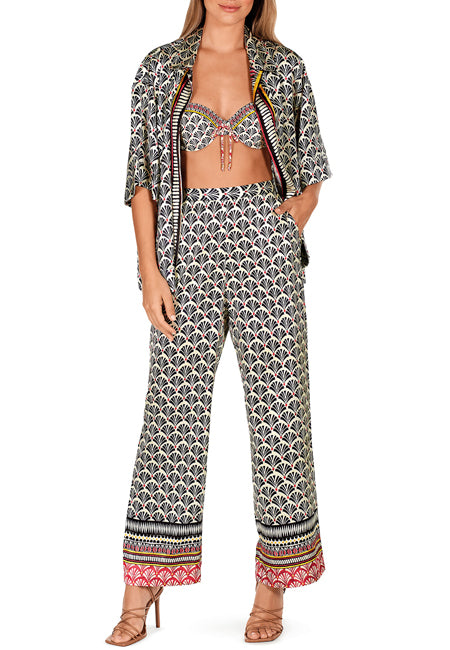 We are very excited to be stocking Spanish swimwear brand Dolores Cortes.  The brand is a family business started over 60 years ago.  It is known for its stylish design and amazing comfort.   These beautifully patterned wide-leg trousers feature an elasticated back and side pockets.  Pair with the matching blouse for an elevated resort look, or wear with your favourite t-shirt for a cool weekend look.  Can also be worn with the matching bikini top or swimsuit.