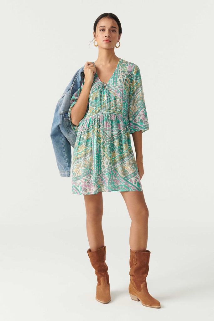 This fun and flirty Fleur dress from uber cool French brand ba&sh is the perfect little mini.  Crafted from their signature super soft fabric and in a pretty green print this dress features a flattering v neck, wide flared sleeves and a relaxed shape.  Wear with your favourite trainers for a relaxed look or a pretty pair of sandals for a more evening look.