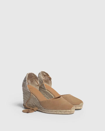 The Carina Espadrilles from Castaner are handmade in suede and feature thin wrap-around ties at the ankle. Wear them with everything from shorts to dresses - allow yourself be transported to the Mediterranean.  