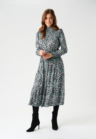 The Kristen Midi Dress is feminine and discretely flirty!  Crafted from super soft stretch viscose crepe and featuring smocking details at the cuffs and collar, ruffles at the shoulder and a slight gathering at the waist this is a shape that will flatter most.  In a pretty floral print this looks fab paired with your favourite boots and a leather jacket. 