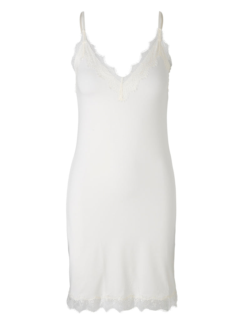 This beautiful feminine slip dress features adjustable spaghetti straps for a custom fit and a lace V-shaped neckline. Made from a blend of polyester and elastane that feels incredibly soft against your skin. Also available in black, it is versatile enough to wear as a slip underneath your dresses or as sleepwear.