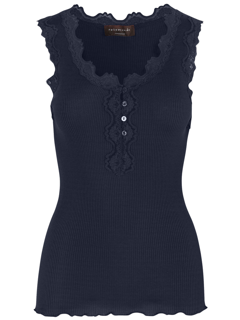 This fab silk and cotton cami from Rosemunde, features a slim fit with buttons, lace at the neckline and no side seams. This is the perfect layering piece for all your winter jumpers and cardigans. Also available in other colours. 