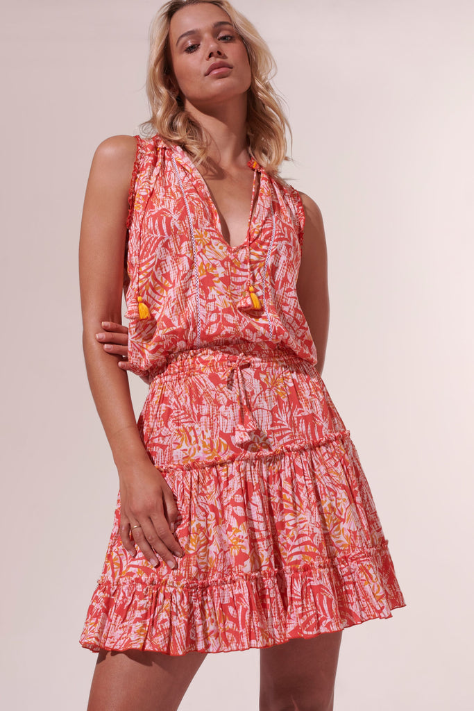 The Clara Dress from Poupette St Barth is the ideal hot summers day dress. Featuring a smocked adjustable waistband, a v-neckline with tassel detail ties and delicate frills - this dress is lightweight and super comfortable. Wear with espadrilles or trainers!