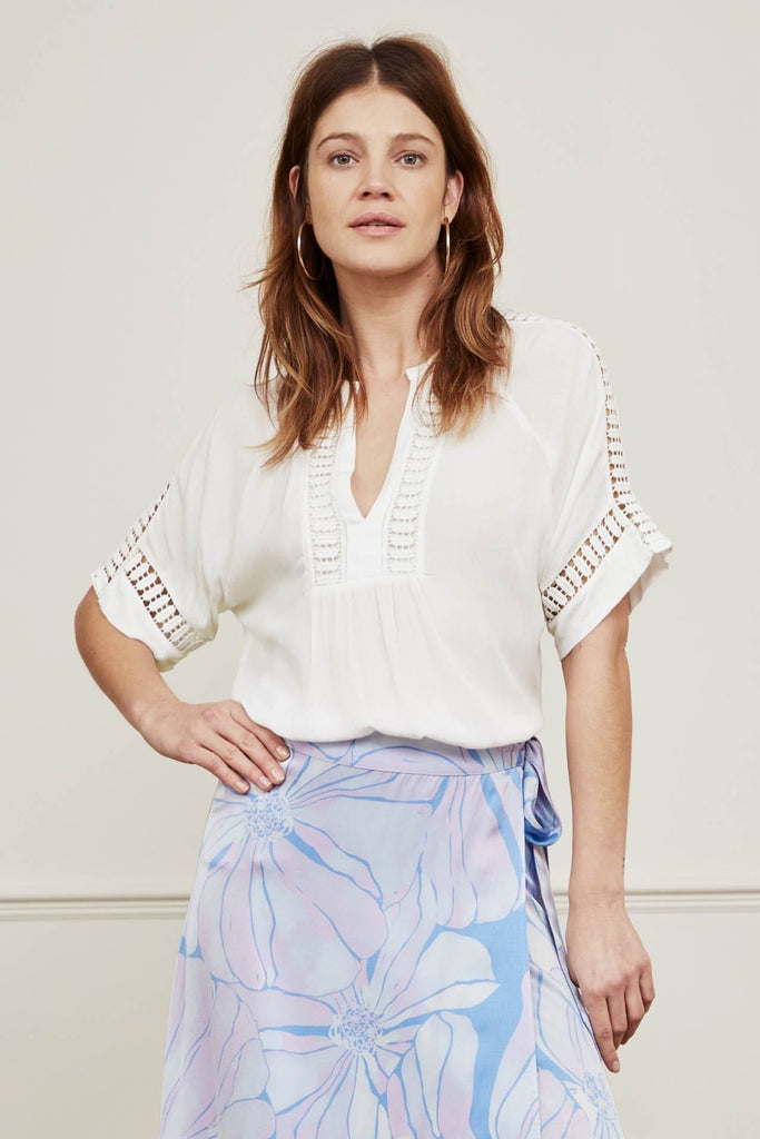 Pretty cream blouse from Fabienne Chapot featuring cut out details on the neck, sleeves and back.  With a super soft feel and feminine look this is perfect paired with your favourite Summer shorts or denim.
