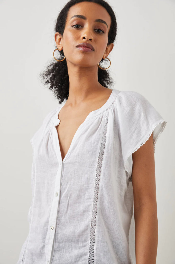 This button down Alena Top from Rails has a classic fit, a v-neckline and raglan flutter sleeves for extra femininity. This super soft, lightweight shirt features subtle lace detailing - perfect for everyday summer wear.