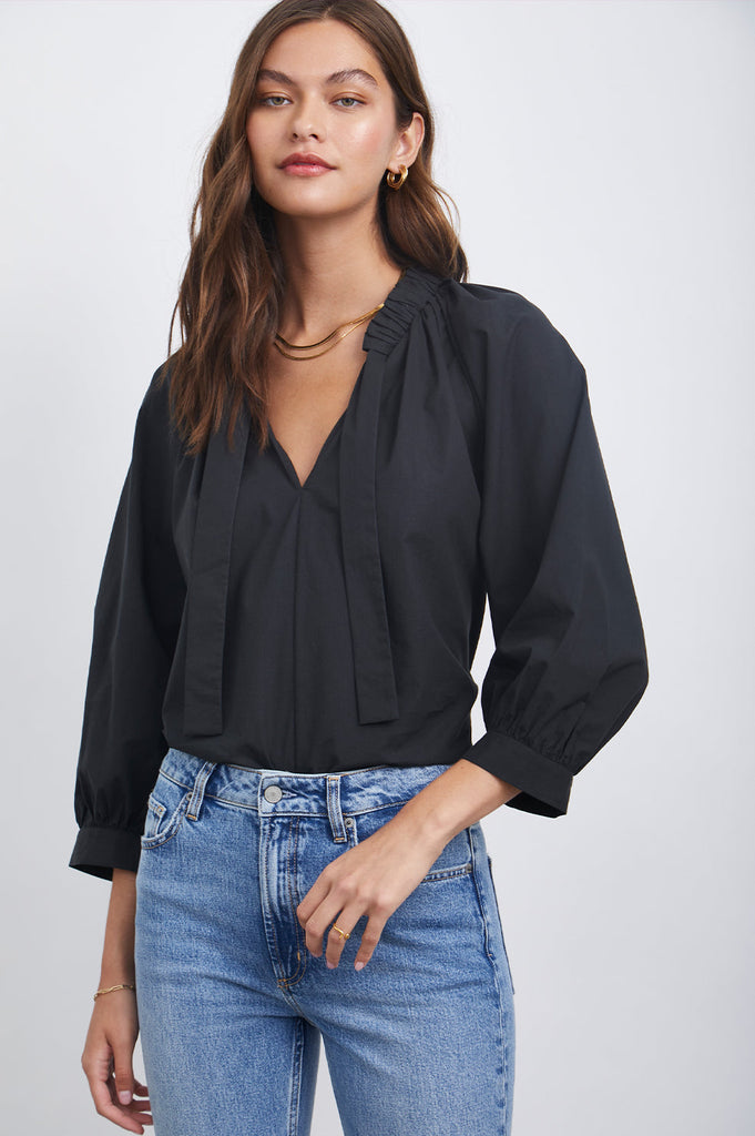 This pretty pullover top from Rails in easy to wear black is crafted from crisp cotton poplin and features a wide encased neck tie, raglan sleeves and a flattering v neck.  A perfect option to throw on with your favourite denim when in a rush but still want to look lovely!