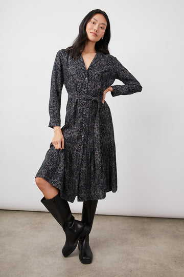 The Beatrice dress is crafted from Rails' very soft rayon crepe in a great grey and black print. This dress features a button-down front, self-belt, feminine ruffle details at the hem, and a flirty fit. This super flattering dress is just right for dressing up or down and will suit every occasion.