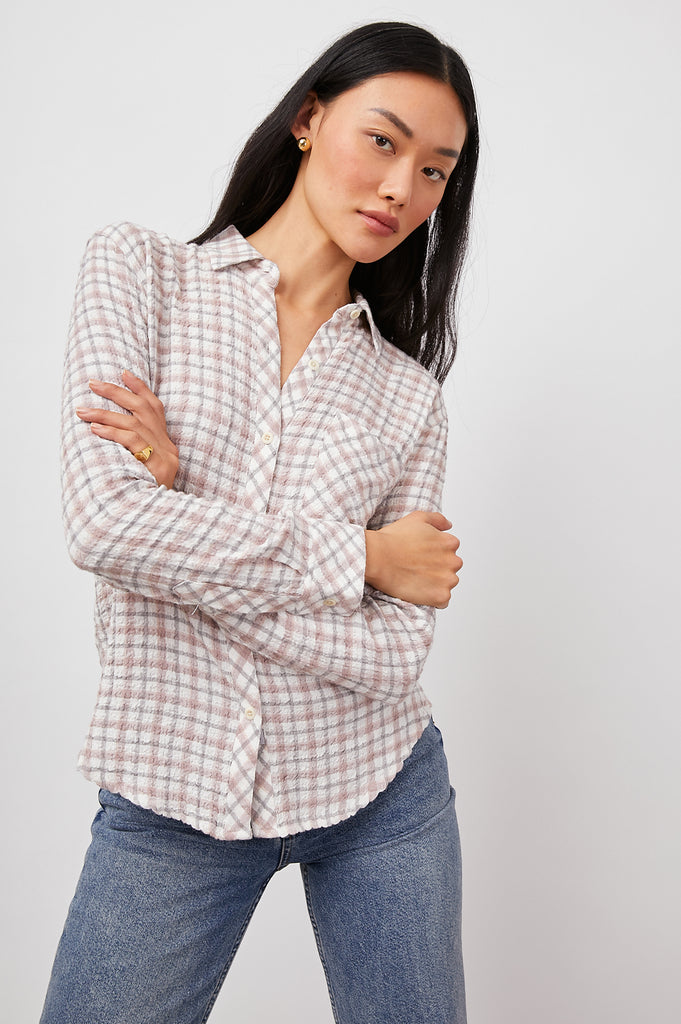 The Brady Top is a lightweight button-down with a unique textured effect in a subtle pink and grey colour-way. This shirt is bound to be your new favourite layering piece. Made from stretch seersucker fabric, this shirt comes in a relaxed fit and has a single patch pocket at chest.