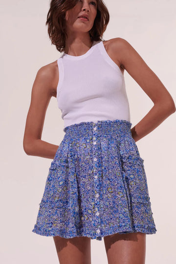 The Amanda mini skirt from Poupette St Barth is inspired by gypsy-spirit patchwork. Featuring strips of ruffles and frills, the smocked waistband means the skirt is cute but comfy to wear. Pair with the matching Amanda top for easy summer styling.