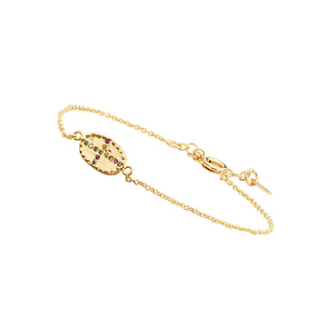 The By Bazile Bracelet is a gorgeous delicate brushed 3 micron matt gold plated oval set with tiny rainbow coloured jewels in the shape of an irregular cross on a fine extendable chain.  This is the perfect finishing touch to any outfit.  Pair with the matching earrings for a put together look.