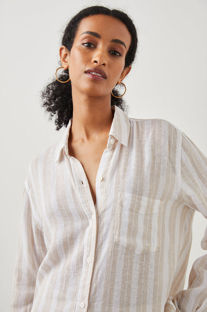 Striped, long sleeve button-down top with high-low shirt tail hem, and single chest pocket. Lightweight, breezy linen fabric mixed with a relaxed body shape makes the Charli the perfect Southern California inspired button-down. Looks fab paired with your favourite denim.