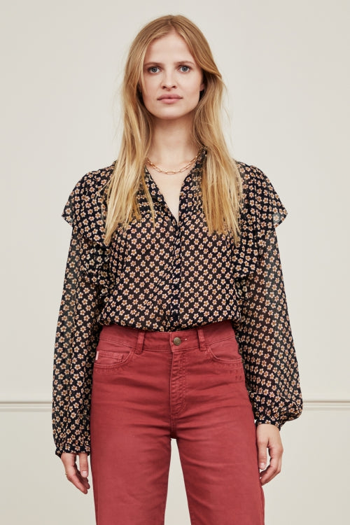 Fabulously feminine blouse from Fabienne Chapot.  Crafted from super soft and lightweight viscose georgette this is a perfect transitional piece.  With a flattering long sleeve, dainty ruffle detail and a button up front this will look perfect paired with your favourite denim.