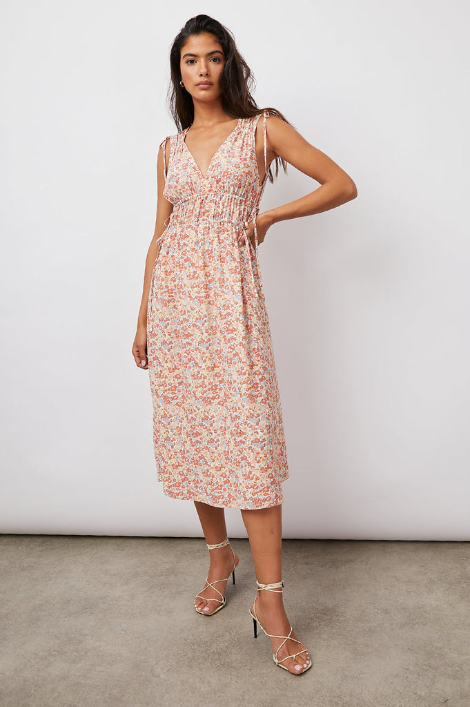 This pretty summer midi dress from Rails features a gorgeous pastel floral print, a v-neckline, a concealed adjustable waist band and adjustable ruching at the sleeve. This is the perfect dress to style with white trainers for a more casual look or dress up with a pair of espadrilles.