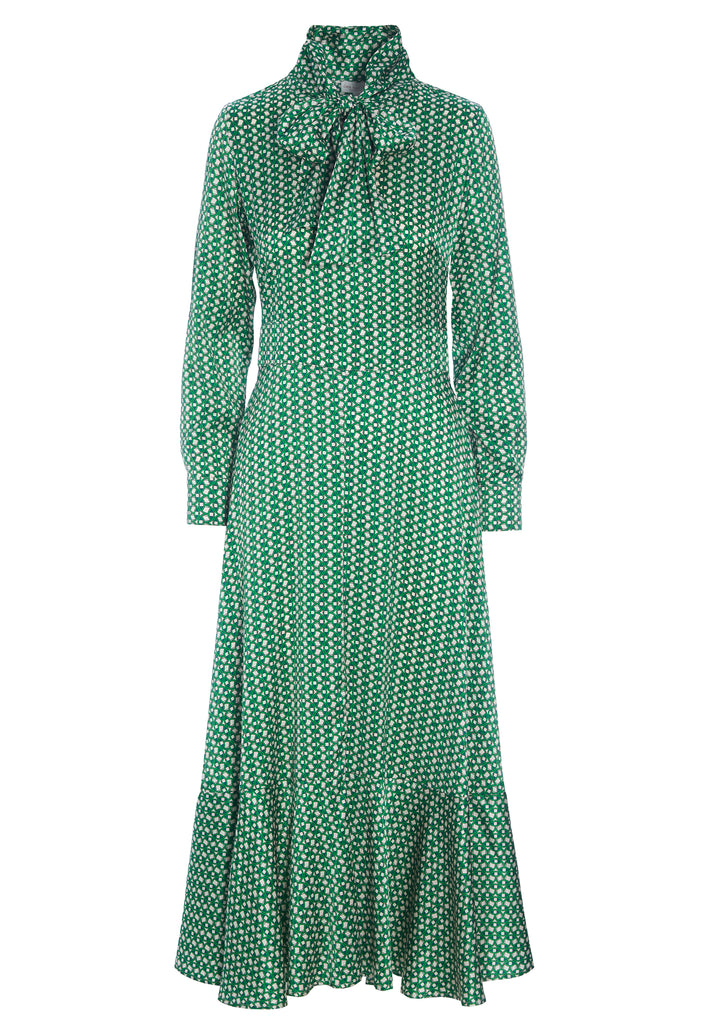 The Olga Dress from dea kudibal features a pussycat bow at the neck, giving this silk satin green printed dress a sophisticated finishing touch. The slim fit body gives way to a figure-skimming bias cut skirt that flares out in a flattering and elegant silhouette. 