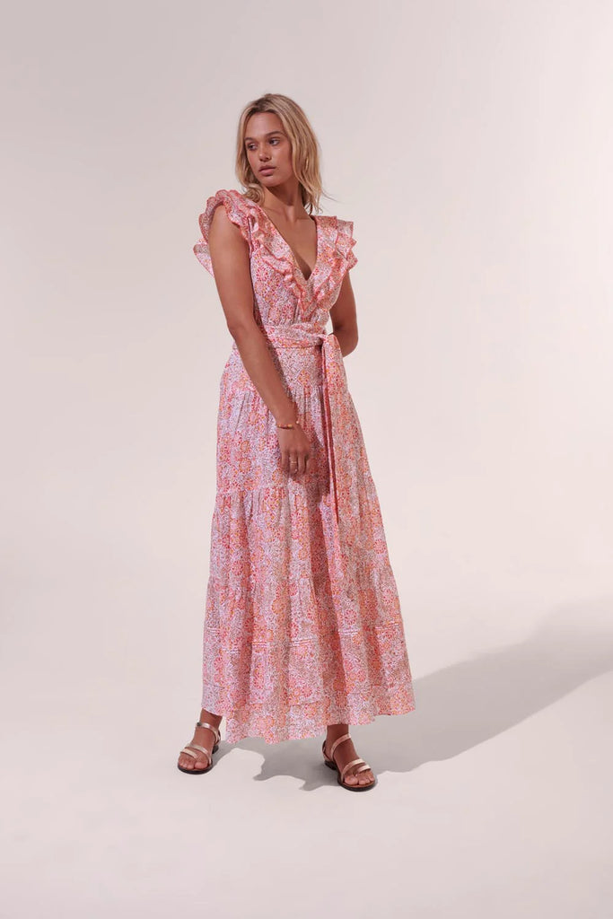 Slip on the Della long dress from Poupette St Barth and immediately look effortlessly chic. With dainty butterfly sleeves, a flattering v neck and a bow-tie belt this is timeless dress that is elegant at all angles.
