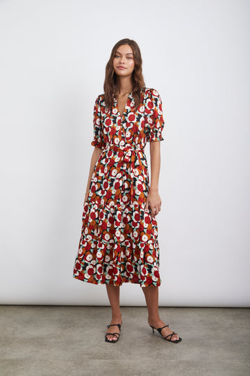 This pretty pullover dress from Rails features a tiered skirt and feminine details. Made from lightweight rayon crepe, this unlined midi dress has a v-neckline, natural shell loop buttons, full sleeves with shirring at the shoulders, a belt and ruffle detailing.