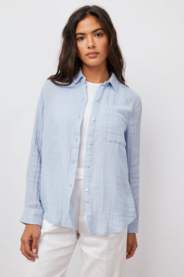 Perhaps the prettiest blue ever!  Our favourite super comfy 100% cotton gauze button down shirt is back in a pastel blue.  Featuring a classic feminine fit, patch pocket at the chest and a longer back hem this looks great paired with Paige Amber in white. Ellis definitely deserves a place in your wardrobe and we would suggest you get them in every colour! 