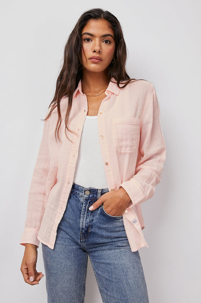 Super comfy 100% cotton gauze button down shirt in the most beautiful pastel pink colour.   Featuring a classic feminine fit, patch pocket at the chest and a longer back hem this looks great paired with your favourite denim.  A classic for elevated comfort.