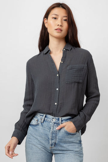 Yes please may we have a new easy black shirt! Super comfy 100% cotton gauze button down shirt in always wearable white. Featuring a classic feminine fit, patch pocket at the chest and a longer back hem this looks great paired with your favourite denim.  A classic for elevated comfort.